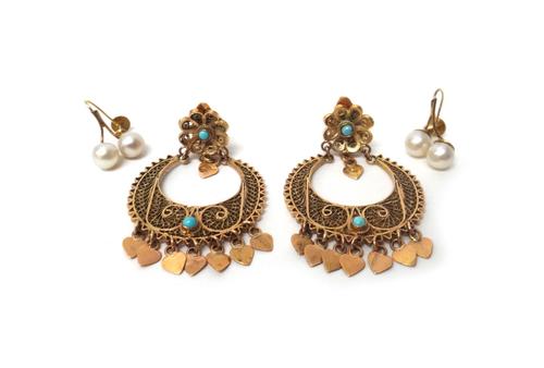 A pair of Middle Eastern gold filigree and turquoise set earclips, each of circular form, the front with a fringe of heart shaped drops and with a flo