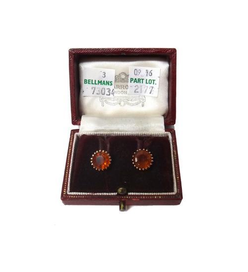 A pair of gold and citrine set single stone earstuds, each claw set with a circular cut citrine, the backs with post and butterfly clip fittings, with