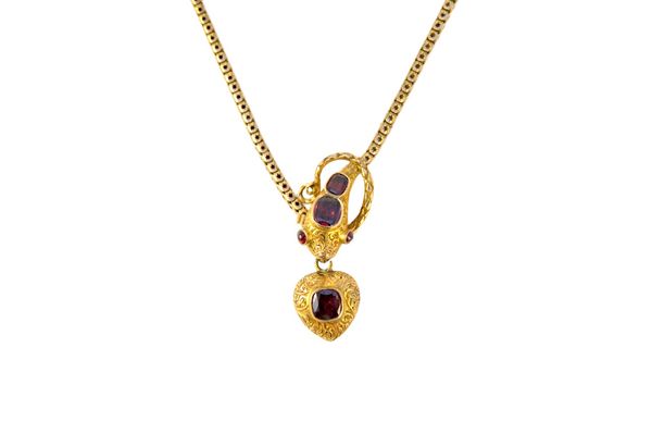 A Victorian gold and garnet set necklace, the front designed as a serpent's head, with a heart shaped pendant locket fitted to its mouth, mounted with