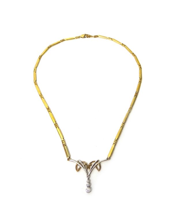 A gold and colourless gem set three stone pendant necklace, in a bar and pierced link design, the front mounted with a row of three graduated circular