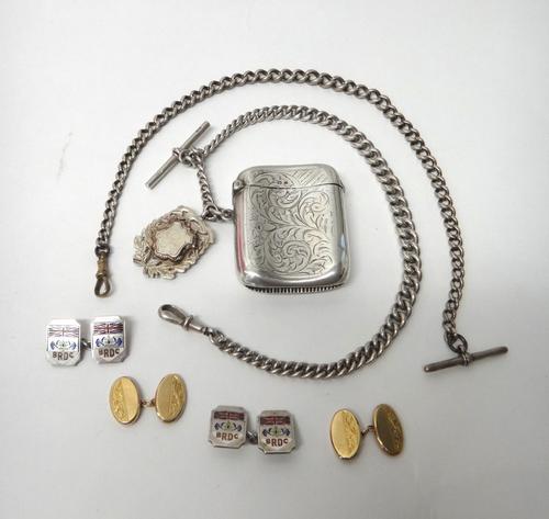 A pair of 9ct gold oval cufflinks with scroll engraved decoration, Chester 1927, weight 3.3gms, a pair of silver and enamelled cufflinks, detailed BRD