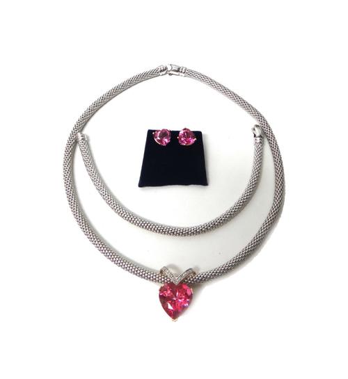 A 9ct white gold collar necklace, in an interwoven design, on a sprung hook shaped clasp, the front with a pink heart shaped gem set 14ct yellow gold