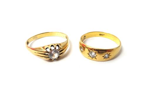 A gold and diamond set three stone ring, star gypsy set with a row of cushion shaped diamonds, detailed 18ct, ring size S and a half and a 9ct gold an