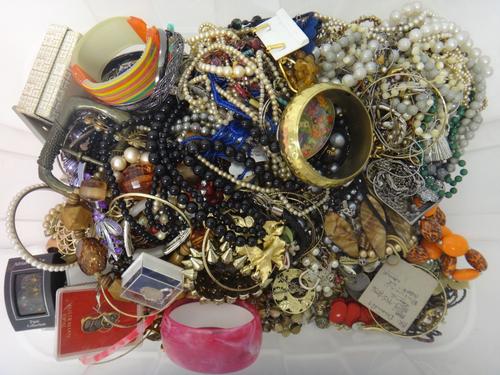 A large collection of costume jewellery, including necklaces, brooches, earrings, beads, imitation pearls, lady's and gentlemen's wristwatches, a pair