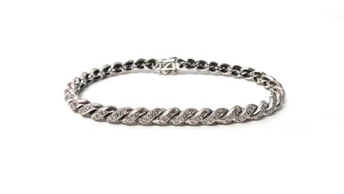A white gold and diamond set bracelet, in a ropetwist link design, mounted with circular cut diamonds on a snap clasp, detailed 750, length 17cm.