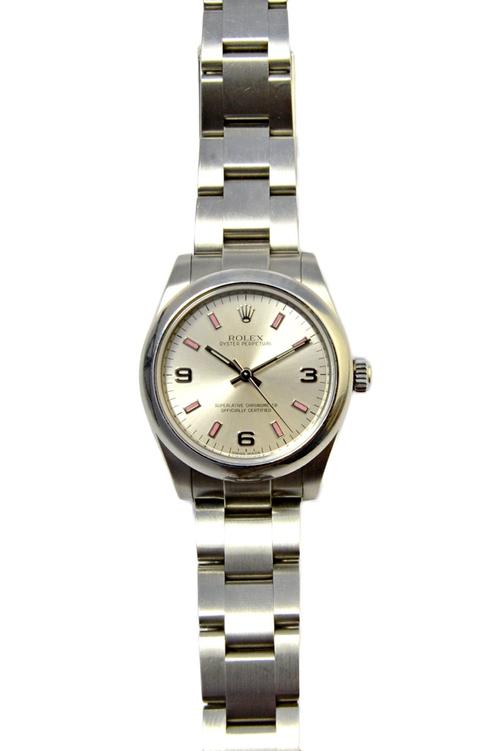 A steel Rolex Oyster Perpetual bracelet wristwatch, the signed circular silvered dial with pink baton and silvered Arabic numerals and with centre sec
