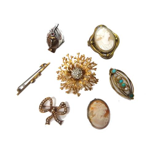 A gold and seed pearl set brooch, designed as a ribbon tied bow, a turquoise and cultured pearl set oval brooch, two shell cameo brooches and three fu