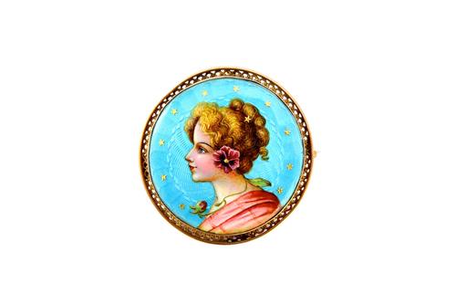 A gold mounted and enamelled circular brooch, designed as the portrait of a lady with flowers, on a translucent pale blue enamelled ground, decorated