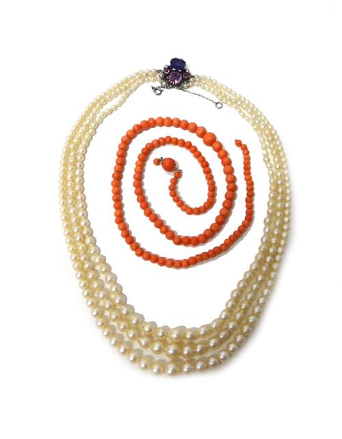 A three row necklace of graduated cultured pearls, on an amethyst and gem set clasp, fitted with a safety chain and a single row necklace of graduated