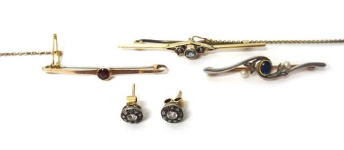 A pair of diamond set cluster earstuds, each mounted with the principal cushion shaped diamond at the centre, |(one rose diamond having a marcasite re
