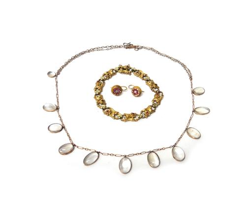 A pair of gold, ruby and diamond set cluster earrings, having ropetwist borders and with wire fittings, detailed 15 CT, a moonstone necklace, mounted
