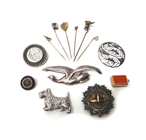 A gold and opal set single stone stick pin, a seed pearl set stick pin, designed as a wishbone, four further stick pins, an agate set rectangular pend