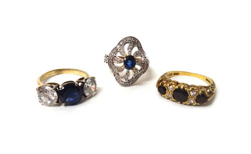 A gold ring, mounted with three circular cut sapphires and with two pairs of small circular cut diamonds, mounted at intervals, a gold, blue and colou