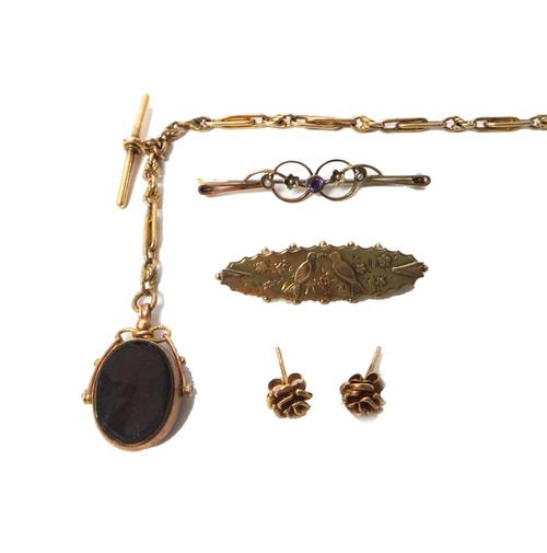 A 9ct gold watch Albert chain, in a twin bar and knot link design, fitted with a 9ct gold T bar, a base metal swivel and with a 9ct gold mounted paste