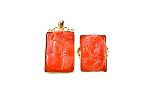 A gold mounted coral cameo ring, the rectangular coral cameo carved as the portrait of a classical lady, between foliate split shoulders, detailed 18