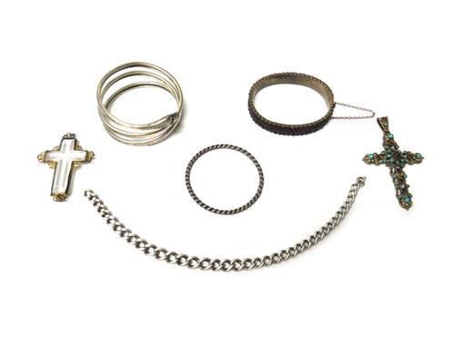 A Bohemian garnet set oval hinged bangle, on a snap clasp, fitted with a safety chain, a bangle formed as a coiled snake, a child's bangle, in a ropet
