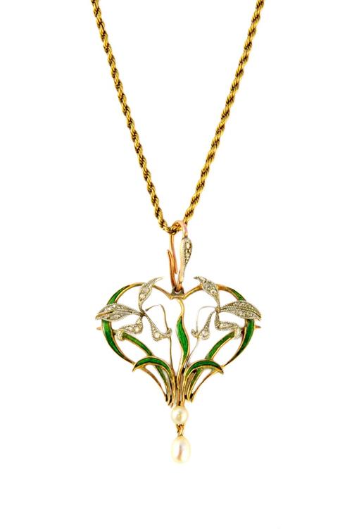 A gold, rose diamond and seed pearl set and green enamelled Art Nouveau pendant, circa 1910, decorated with floral and foliate motifs, on a gold ropet