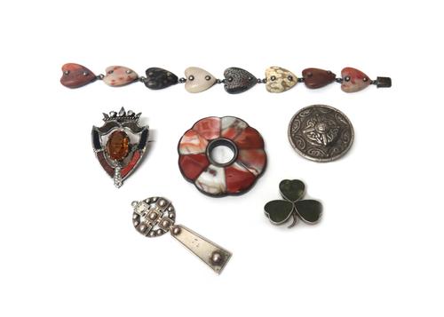 A Victorian vary coloured agate and citrine set brooch, probably Scottish, designed as a shield with a crown surmount, a Scottish silver brooch, of ci