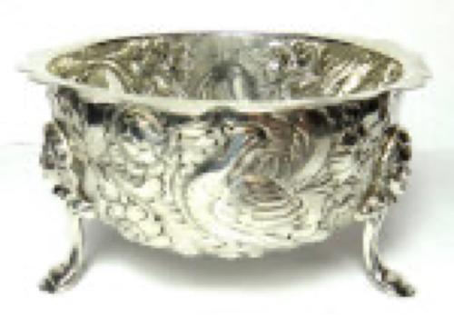 A Coquillia nut necklace, probably Chinese, early 20th century, strung with twenty-nine mostly oval beads, with carved and pierced decoration and four