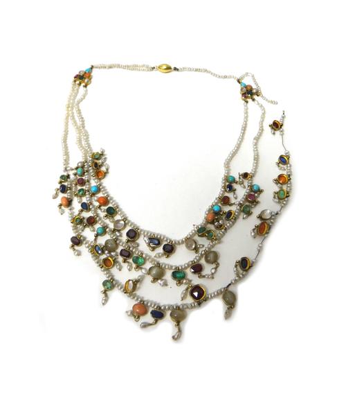 A gold mounted vary coloured gemstone and seed pearl necklace, in a three row design, the gold mounted gem set pendants with seed pearl drops, on a ba