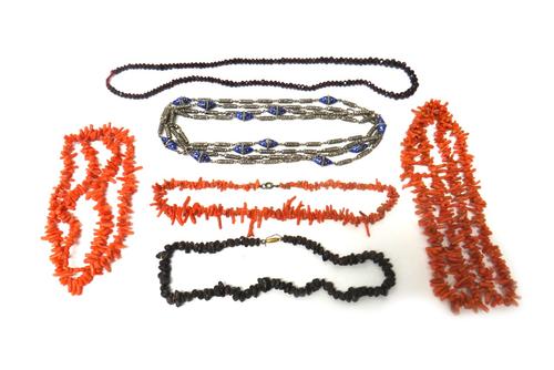Three single row necklaces of branch corals, a single row necklace of faceted garnet beads, graduating in size to the front, a single row necklace of
