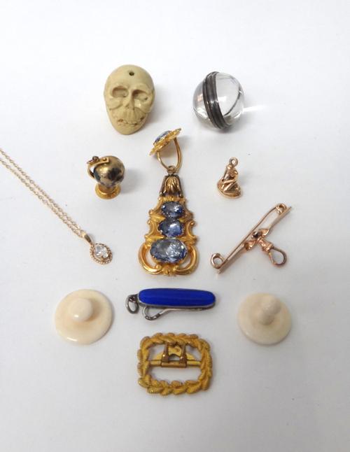 A gold and sapphire set single earring, mounted with four foil backed cushion shaped sapphires, circa 1840, a gold mounted globe charm, detailed 9 CT,