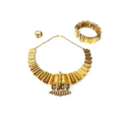 A group of Eastern jewellery, comprising; a collar necklace, a circular hinged bangle and a ring, probably Indian in a 1950's design, combined weight