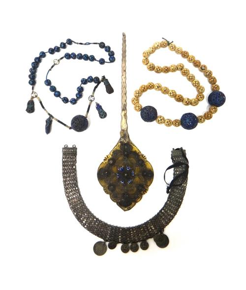 Mostly Eastern jewellery, including; six Indian Pertubghar green glass and gilt panels, a collar necklace having pendant mounted imitation Roman coins