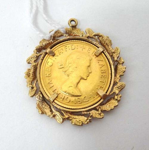 An Elizabeth II sovereign 1968, in a 9ct gold pendant mount, decorated with a border of oak leaves and acorns, weight 12 gms.