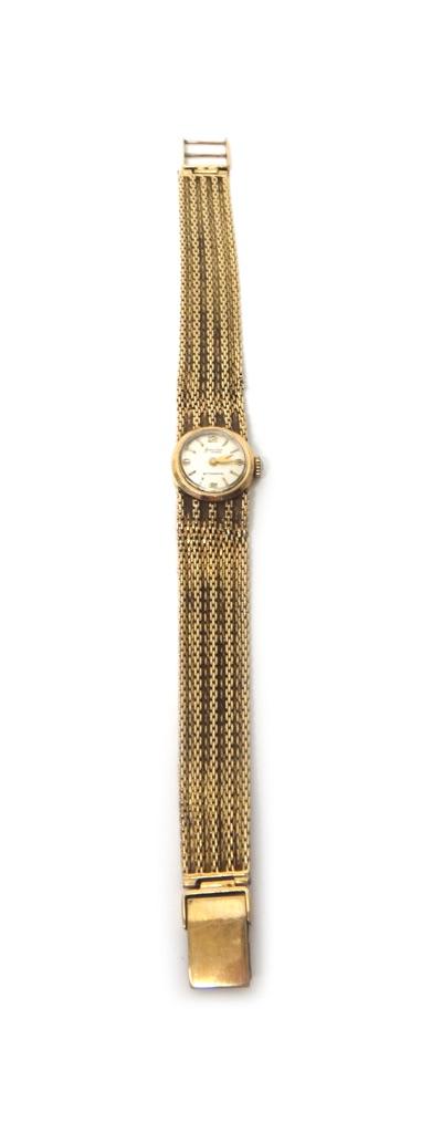 A lady's 9ct gold Accurist bracelet wristwatch, the signed circular silvered dial with gilt baton shaped and Arabic numerals, on a woven link bracelet