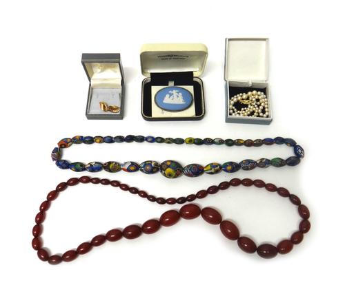 A single row necklace of graduated cultured pearls, a pair of 9ct gold ear studs, an oval Wedgwood brooch, with a case, four further brooches, two bea