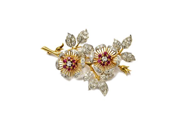 A gold, diamond and ruby set brooch, designed as a floral spray, mounted with circular cut diamonds and with circular cut rubies by Crop and Farr, det
