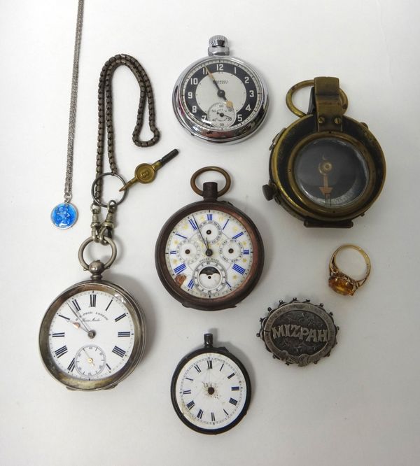 A base metal cased keyless wind open faced calendar pocket watch, a silver cased openfaced pocket watch with a key and a chain, an Ingersoll Triumph o