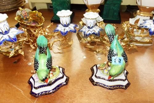 A pair of Italian 'Mcmgami' porcelain and gilt metal mounted twin branch candelabra moulded with birds (2).
