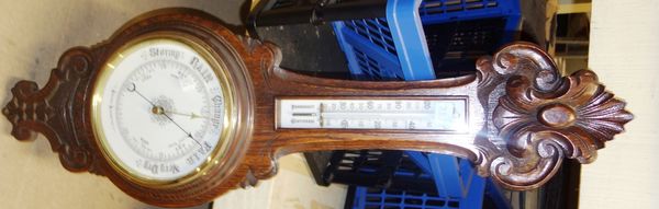 A 20th century oak wheel barometer.