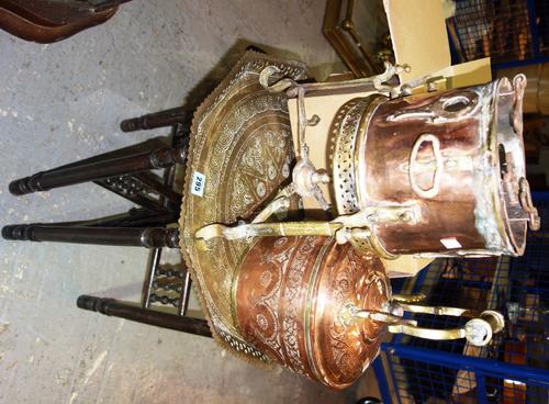 A group of metalware collectables including folding eastern brass tray table, Eastern copper, a brass kettle, a blue glass reservoir oil lamp and sund