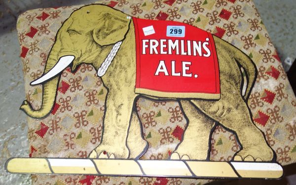A reproduction metal advertising sign for 'Fremlins Ale' farmed as an elephant.