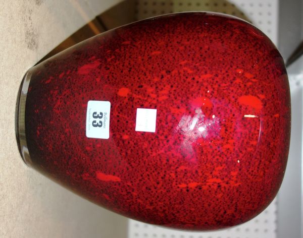 A red glass studio vase, post war, with internal white enamel casing and a mottled red exterior, unsigned, 25cm high.