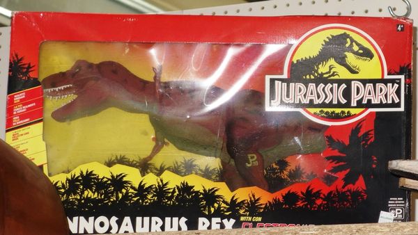 A Jurassic Park T-Rex toy, from the original 1990's film, in the original box.