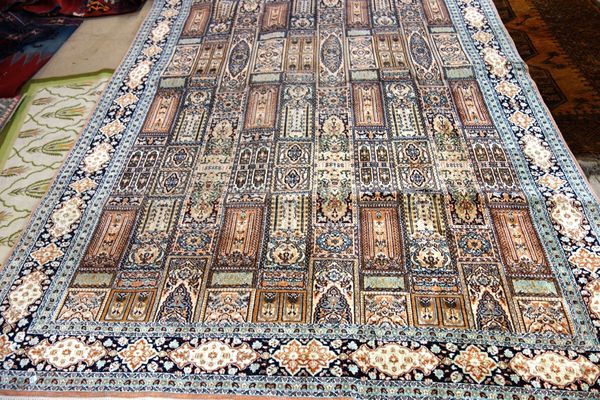 An Indian silk carpet 275cm x 187cm and a golden Afghan carpet, 204cm x 170cm. (2)
