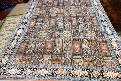 An Indian silk carpet 275cm x 187cm and a golden Afghan carpet, 204cm x 170cm. (2)