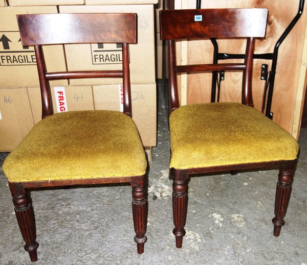 A pair of William IV mahogany framed dining chairs on reeded supports. (2)
