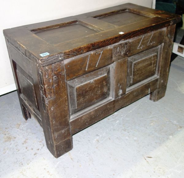 A 17th century style stained pine coffer with double panel top and front, 82cm wide.