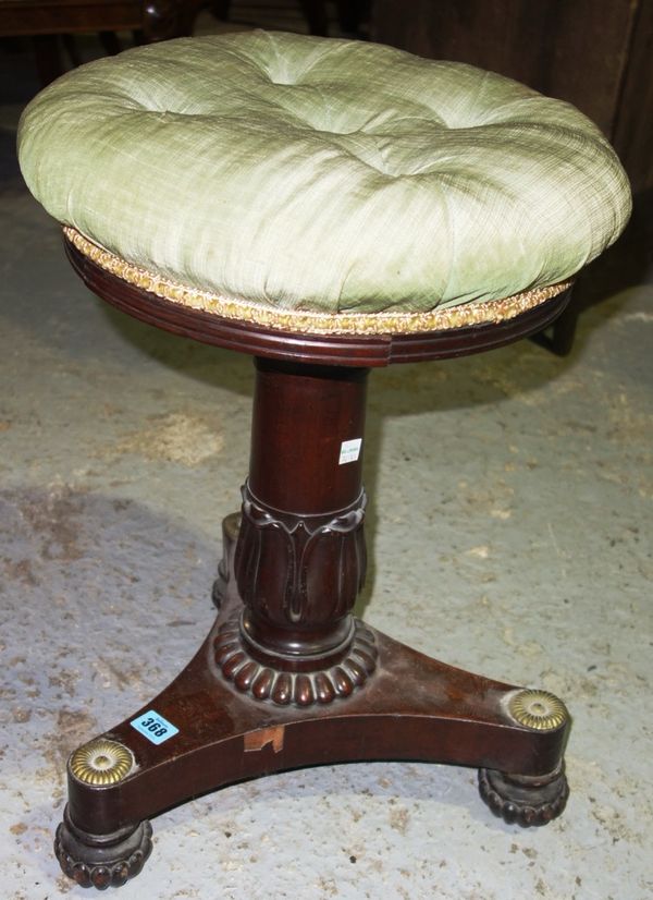 A William IV circular mahogany and gilt metal mounted adjustable piano stool.