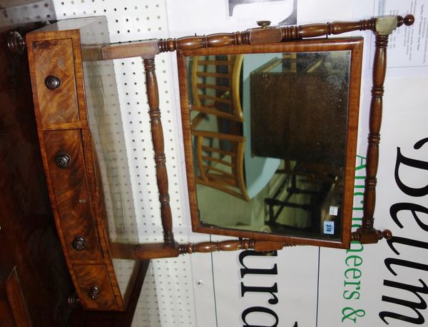 A 19th century mahogany bowfront toilet mirror.