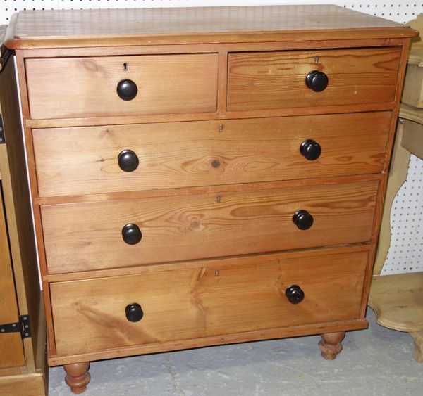 A pine chest of two short and three long drawers.