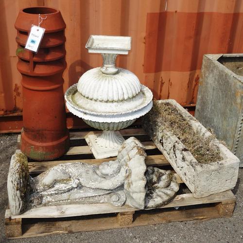A pair of white painted jardinieres, a stone figure holding a shell, two chimney pots and a stone rectangular trough, (qty).