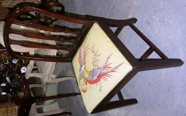 A pair of George III mahogany side chairs with tapestry seats, decorated with Chinese pheasants.