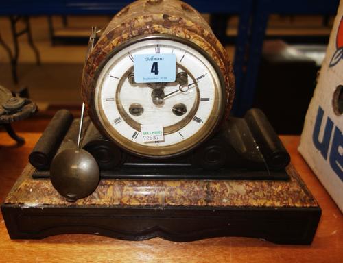 A 19th century black slate and marble cased eight day mantel clock.