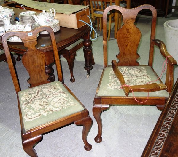 A set of six Queen Anne style oak dining chairs.